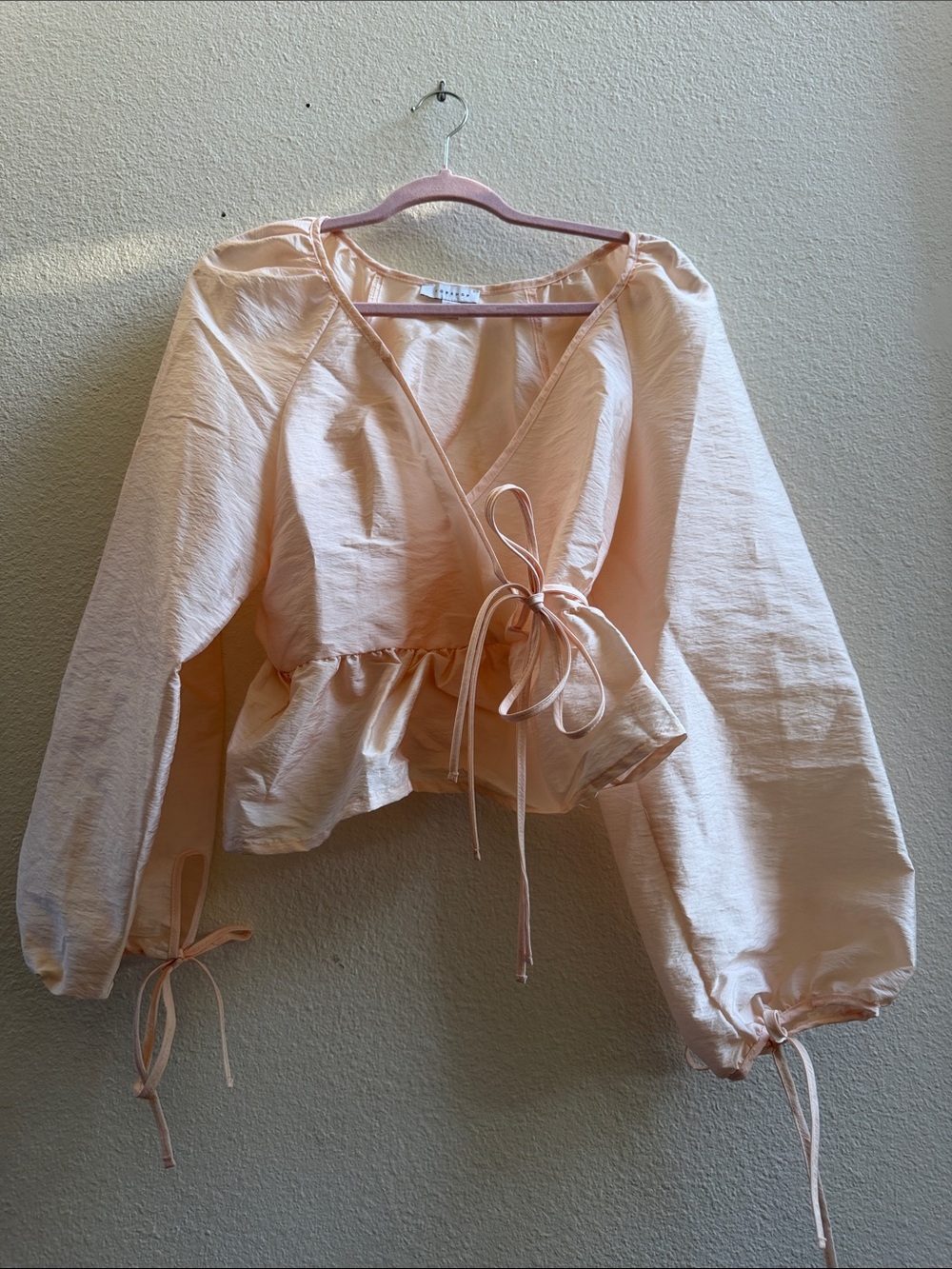 Peplum Tie-Front Blouse in Light Peach